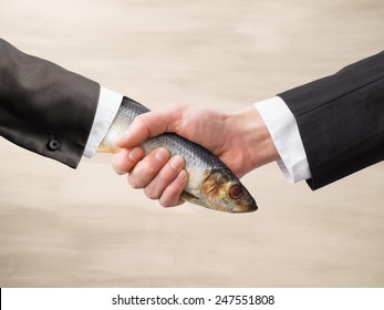 Dead Fish Handshake - Shutterstock ID 247551808