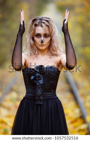 Dead horror warlock woman, scary female witch possessed by evil spirits. Book cover idea, day, park, autumn