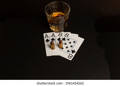 Dead mans hand aces and eight with a shot of whiskey and bullets