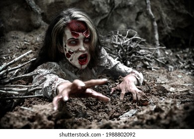 Dead Possessed Woman coming out of the ground - Shutterstock ID 1988802092