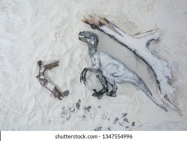 Dead Velociraptor Under The Snow During Ice Age. View From Above Of Dinosaur's Extinction