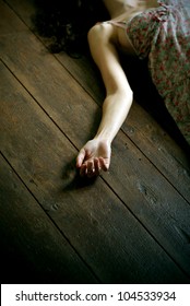 Dead Woman Lying On The Floor, Focus On The Hand