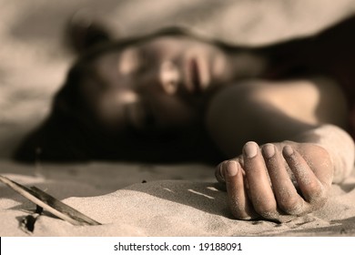 Dead Woman On The Sand