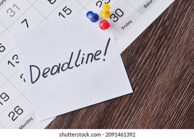 Deadline concept. A paper with Deadline text pinned on monthly calendar. White card with Deadline text pinned with push pins on calendar date. Last day, Last chance concepts - Shutterstock ID 2091461392