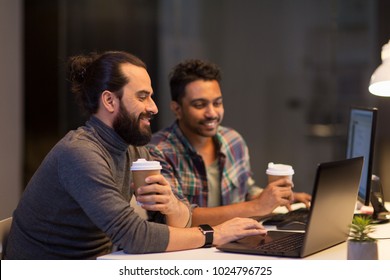 deadline, technology and people concept - creative team drinking coffee and working with computers late at night office - Powered by Shutterstock