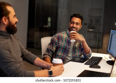 deadline, technology and people concept - creative team drinking coffee and working with computers late at night office - Shutterstock ID 1073291831