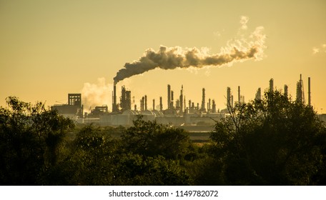 Deadly Future Smoke Stack Oil Refinery Carbon Pollution and Climate Change. Global warming and the destruction of our environment in Corpus Christi , Texas , USA - Shutterstock ID 1149782072