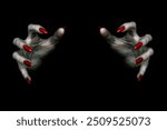 Deadly hands of vampire or monster with sharp bloody red nails in the dark. Witchy fingers hold something invisible, low key, selected focus.