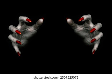 Deadly hands of vampire or monster with sharp bloody red nails in the dark. Witchy fingers hold something invisible, low key, selected focus.