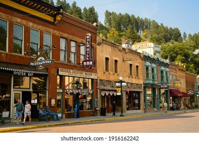 DEADWOOD, SD, USA - SEPTEMBER 15, 2020: Historic Saloons, Bars, And Shops Bring Visitors To Main St. In This Black Hills Gold Rush Town, Famous For Wild Bill Hickok And Calamity Jane.