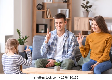 Deaf Mute Family Using Sign Language At Home