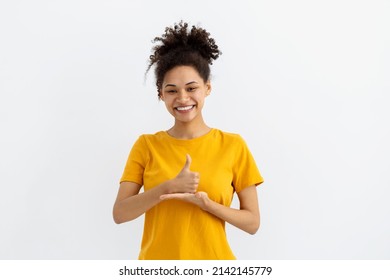Deaf mute young African American woman on white background - Powered by Shutterstock