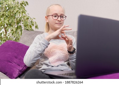 Deaf Teenage Girl Talking Gestures On Laptop. High Quality