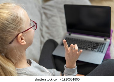 Deaf Teenage Girl Talking Gestures On Laptop. High Quality