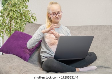 Deaf Teenage Girl Talking Gestures On Laptop. High Quality