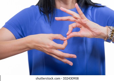 Deaf woman using sign language, close up, isolated on white - Shutterstock ID 332430908