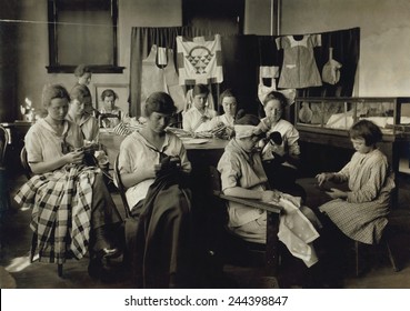 Deaf-mute girls sewing and darning in a training school in Sulphur, Oklahoma. April 1917 photo by Lewis Hine.
