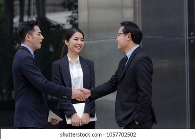 Deal. Asian Business People Team Handshake After Finishing Up New Project Plan Business Meeting In The Modern City, Congratulation, Success, Meeting, Partner, Teamwork, Community, Connection Concept