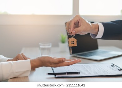 Deal Done Landlord, Realtor Man Hold Key Offer New Renter, Tenant Or Client After Banker Approved, Signed Purchase Agreement. Finance, Financial Of Property, Estate Mortgage Or Apartment, Home Loan.