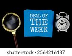 Deal Of The Week text on sticky note with magnifying glass and alarm clock on black background