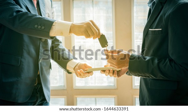 The dealer gives the keys\
to the new owner and gives the money to the auto show of the car\
business.