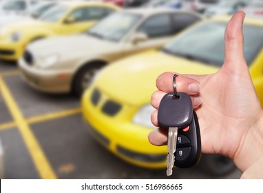 Dealer hand with a car key.