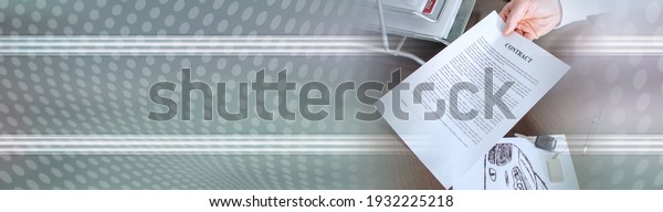 Dealer showing a car purchase contract in car\
dealership; panoramic\
banner