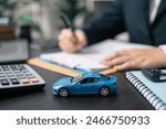 Dealership offered various finance options, including an auto loan or lease, making it easier to buy or rent a car from the company. Agent reviewed contract, finalizing insurance agreement.