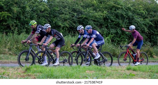 Deanshanger,Northants,UK July 3rd 2022. Group Of Cyclists In Lycra And Wearing Cycling Helmets