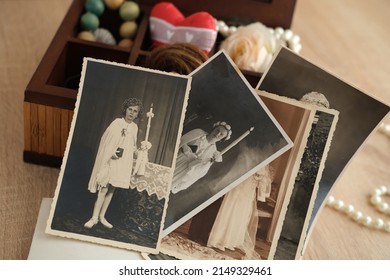 dear to heart memorabilia in an old wooden box, stack of retro photos, vintage photographs of 1940, concept of family tree, genealogy, childhood memories, home archive