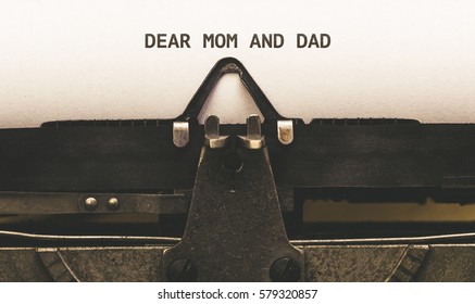 Dear Mom And Dad, Text On Paper In Vintage Type Writer Machine From 1920s Closeup With Paper