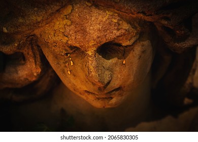 Death Concept. Close Up Angel Crying . Fragment Of An Ancient Statue.