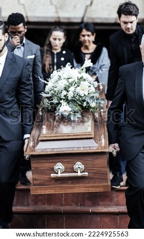 Death, funeral and people with coffin to cemetery, graveyard and morgue for burying, cremation or ritual. RIP, mourning and burial of dead in casket at church ceremony, respect and christian religion