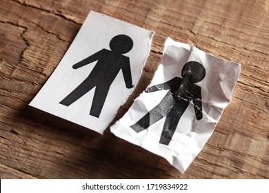 The Death Of Her Husband At Gay. The Concept Of Death In A Couple From Old Age Or Illness. Paper With A Man And A Torn And Crumpled Part With A Man.