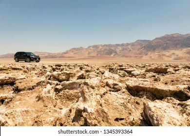 Death Valley National Park, California/USA - 07.12.2017: Black Ford Explorer Parked At Devil's Golfcourse On An Extremely Hot Summer Day.