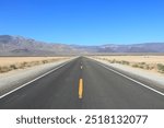 Death Valley road - empty highway in Mojave Desert, California. American scenic road.