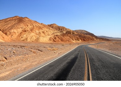 Death Valley road - empty route in Mojave Desert, California. American scenic road.