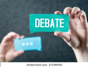 Debate, argument, controversy and disputation concept. Learning to be better speaker. Education to improve dialog. Tell opinions and thoughts in public. Hands holding cardboard speech bubble. - Shutterstock ID 671390920