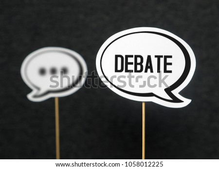 Debate, dialog, communication and education concept. Talking about political opinions. Two cardboard speech bubbles.