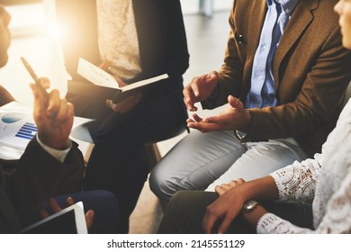 Debate skills are important in selling a product. Cropped shot of a group of unrecognizable businesspeople sitting in a meeting. - Shutterstock ID 2145551129