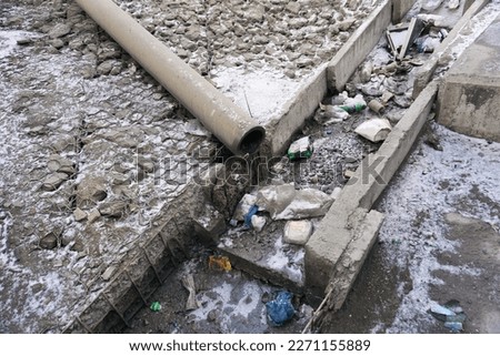 Debris in the drainage ditch will interfere with rainwater runoff.