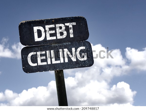 Debt Ceiling\
sign with clouds and sky\
background