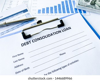 Debt consolidation loan document with graph on table. - Shutterstock ID 1446689966