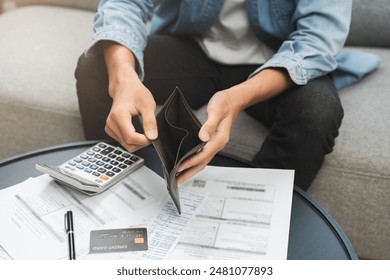 Debt financial concept, stressed problem people asian man, male hand open empty wallet not have budget of money to pay no have credit card, not able payment bill, loan or expense with bank, bankruptcy - Powered by Shutterstock