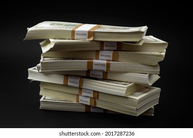 Debt payment, wealth transfer and economic activity concept with pile of money and hundred dollar bills bundle isolated on black background with clipping path cutout - Shutterstock ID 2017287236
