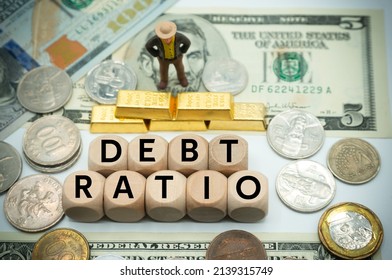 debt ratio refers to a financial ratio that measures the extent of a company’s leverage.The word is written on  money and gold background - Shutterstock ID 2139315749