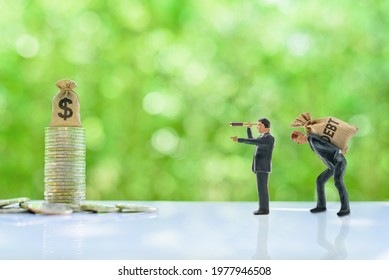 Debt restructuring and debt cancellation, financial concept : Creditor uses a monoscope see and point the way for a debt slave to go forward direction, indebted party has a debt default and npl crisis - Shutterstock ID 1977946508