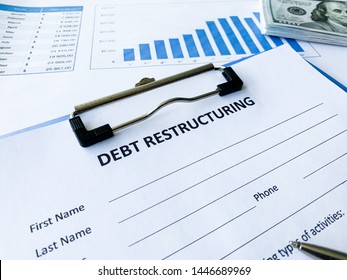 Debt Restructuring Document With Graph On Table.