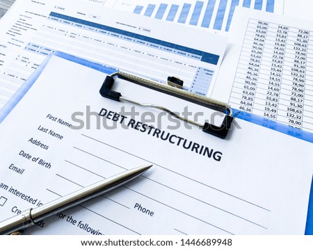Debt restructuring document with graph on table.