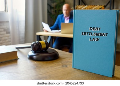  DEBT SETTLEMENT LAW Book In The Hands Of A Attorney. Debt Settlement is A Settlement Negotiated With A Debtor's Unsecured Creditor.
